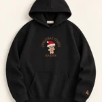 MISK ART Christmas Cookie Baker Hoodie – Black Front, gazelle branding on an ivory studio background