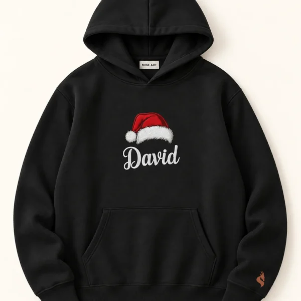 MISK ART Personalized Santa Hat Name Hoodie – Black Front, gazelle branding on an ivory studio background