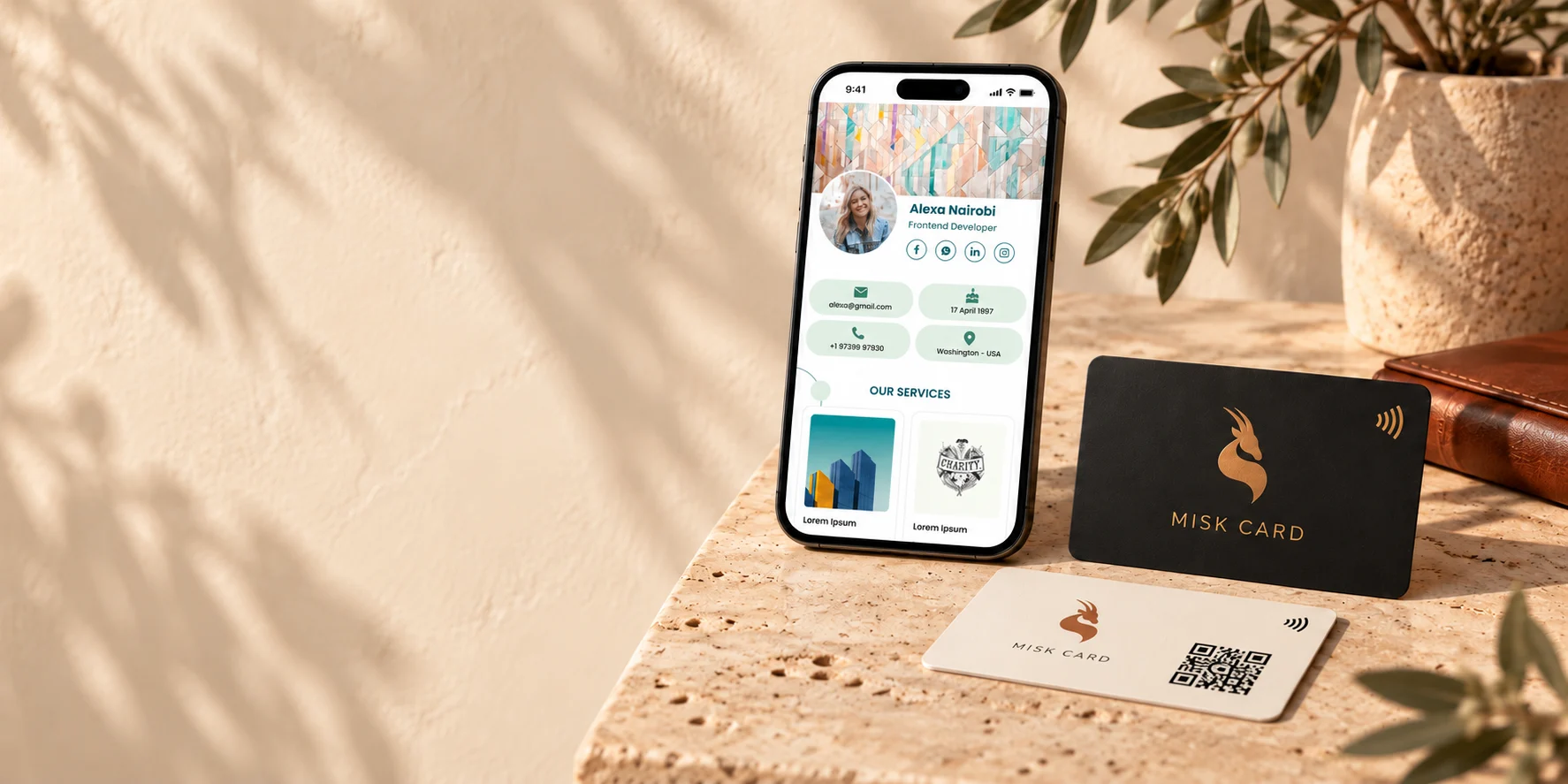 MISK CARD black and ivory NFC cards beside a phone displaying the Professional digital-card theme